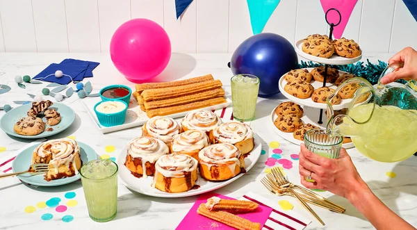 A table full of Cinnabon items at a party